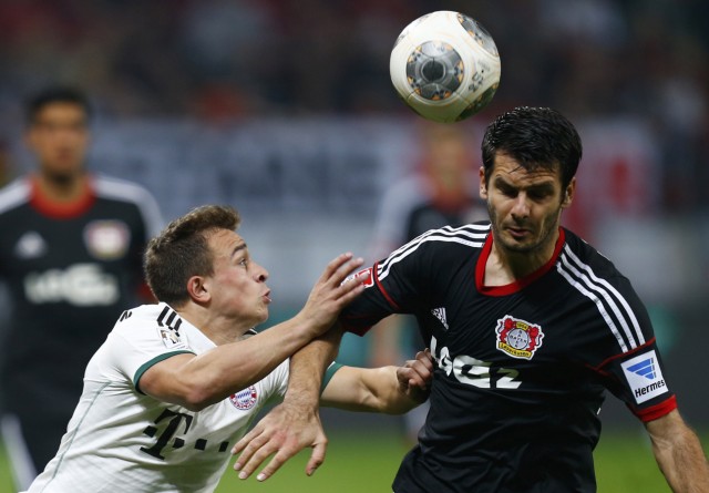 Spahic of Bayer Leverkusen challenges Bayern Munich's Shaqiri during their German first division Bundesliga soccer match in Leverkusen