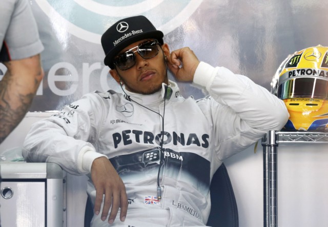 Mercedes Formula One driver Hamilton sits in the garage during the first practice session of the Korean F1 Grand Prix at the Korea International Circuit in Yeongam