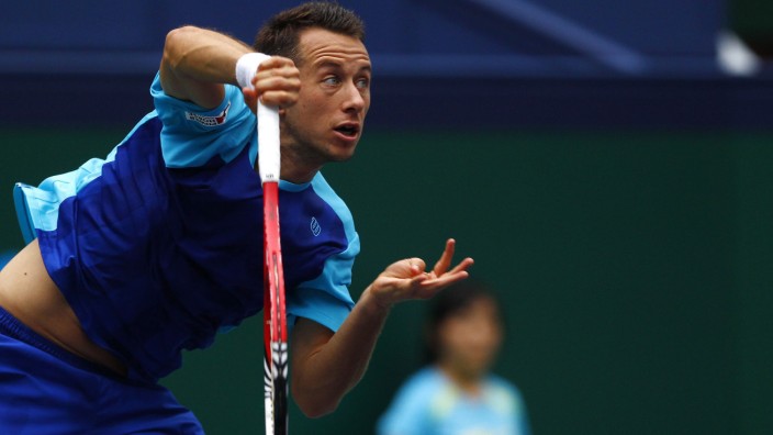 Kohlschreiber of Germany serves to Del Potro of Argentina during their men's singles tennis match at the Shanghai Masters tennis tournament