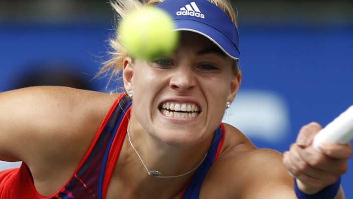 Kerber of Germany returns a shot against Kvitova of the Czech Republic during their singles final match at the Pan Pacific Open tennis tournament in Tokyo