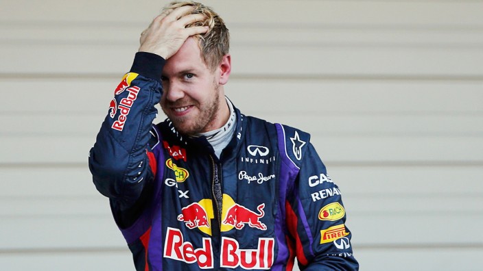 Red Bull Formula One driver Vettel of Germany reacts after winning the Japanese F1 Grand Prix at the Suzuka circuit