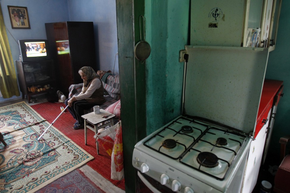 Pensioner Ioana Habianu sits in her house in Aninoasa, west of Bucharest