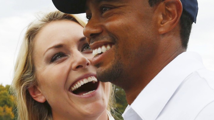 U.S team member Woods celebrates with girlfriend Vonn after Woods won his match and the U.S. won the Presidents Cup on the18th hole in the 2013 Presidents Cup golf tournament at Muirfield Village Golf Club in Dublin