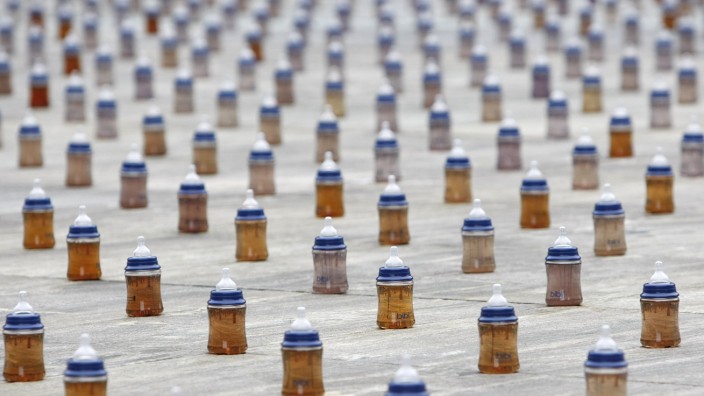 A installation of 4000 baby bottle are placed on the Swiss federal square to mark World Water Day in Bern