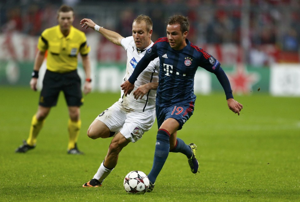 Bayern Munich's Goetze is challenged by Viktoria Plzen's Kolar during their Champions League soccer match in Munich