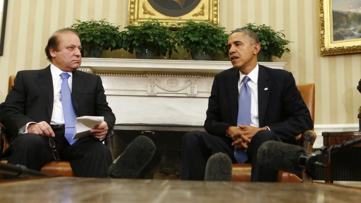 U.S. President Obama speaks with Pakistan's PM Sharif during their meeting at the White House in Washington