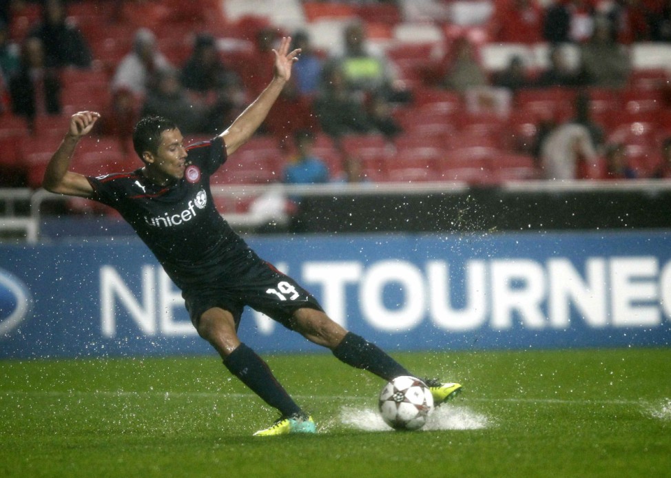 Olympiakos' Fuster controls the ball during their Champions League soccer match against Benfica in Lisbon