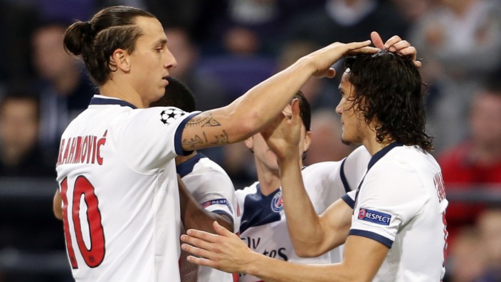 Paris Saint-Germain's Cavani celebrates with Ibrahimovic after scoring against Anderlecht during their Champions League soccer match in Brussels