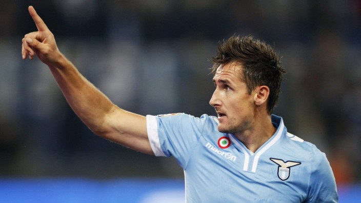 Lazio's Klose celebrates after scoring against Cagliari during their Italian Serie A soccer match at the Olympic stadium in Rome