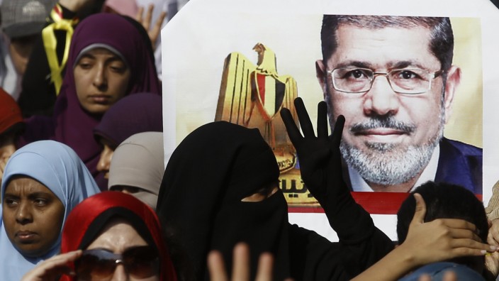 Supporters of ousted Egyptian President Mursi take part in a protest in Cairo