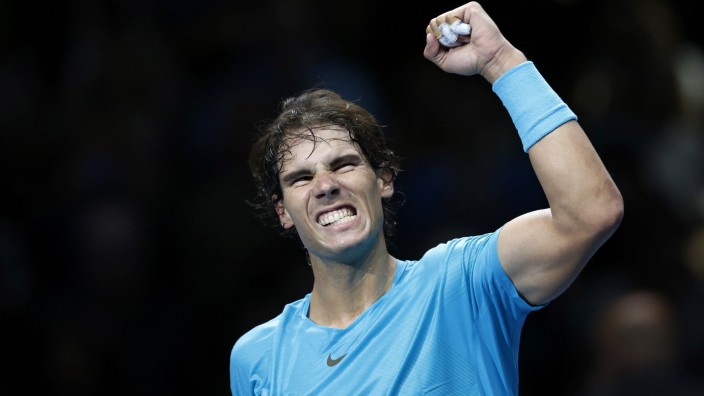 Nadal of Spain celebrates winning his men's singles tennis match against compatriot Ferrer at the ATP World Tour Finals at the O2 Arena in London