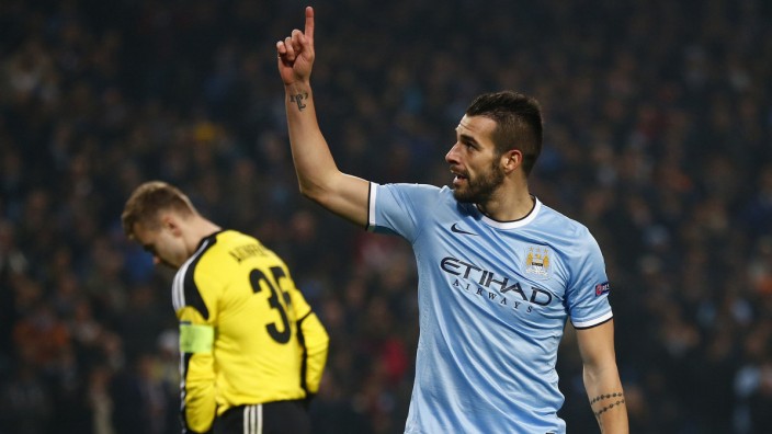 Manchester City's Negredo celebrates scoring his second goal against CSKA Moscow during their Champions League soccer match at the Etihad Stadium in Manchester