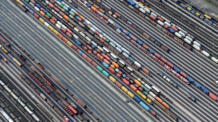 File photo of containers and cars being loaded on freight trains at the railroad shunting yard in Maschen near Hamburg