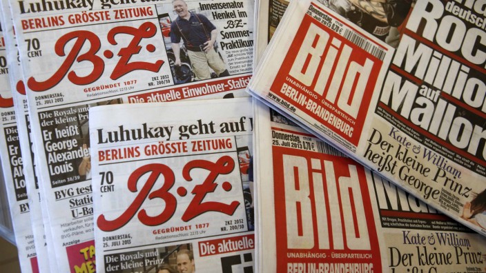 Copies of newspapers of German publisher Axel Springer are pictured in newspaper shop in Berlin