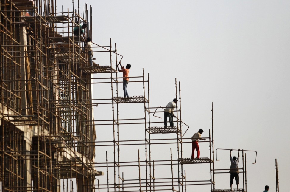 Labourers work at the construction site of a commercial complex in New Delhi