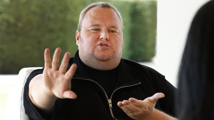 Kim Dotcom gestures as he speaks during an interview with Reuters in Auckland