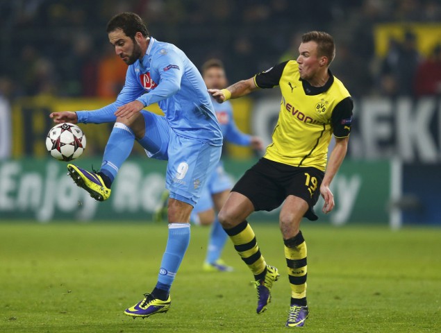 Borussia Dortmund's Grosskreutz fights for the ball with Napoli's Higuain during their Champions League group F soccer match in Dortmund