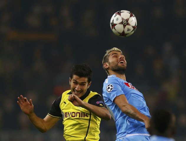 Borussia Dortmund's Sahin fights for the ball with Napoli's Behrami during their Champions League group F soccer match in Dortmund