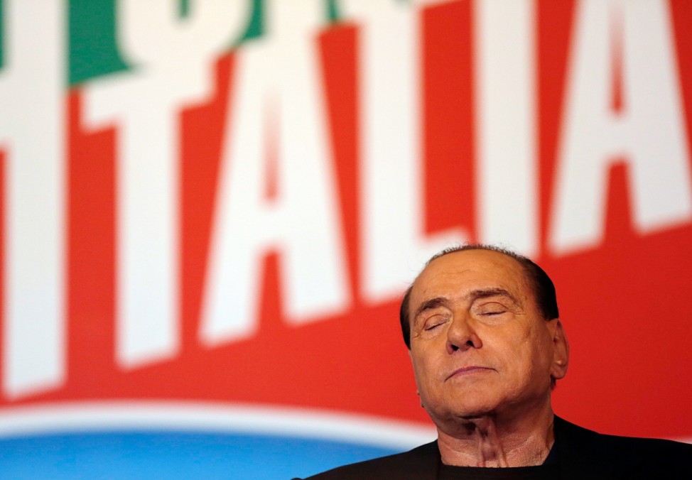 Former Prime Minister Silvio Berlusconi closes his eyes during a speech in downtown Rome