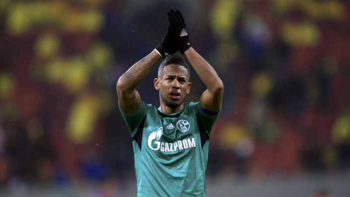 Schalke 04's Aogo acknowledges the crowd after their Champions League soccer match against Steaua Bucharest in Bucharest