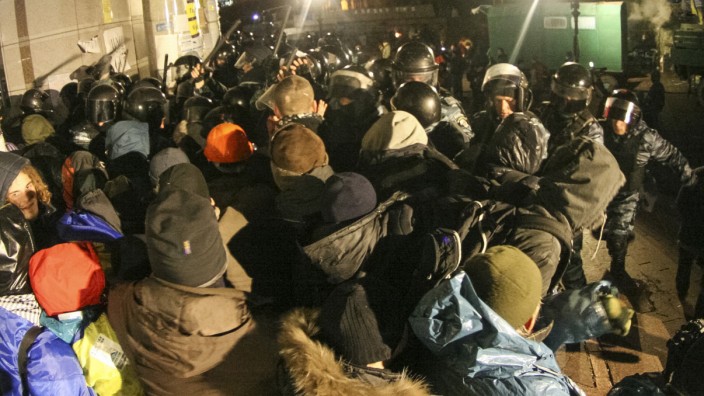 Protesters scuffle with the police during a demonstration in support of EU integration at Independence Square in Kiev
