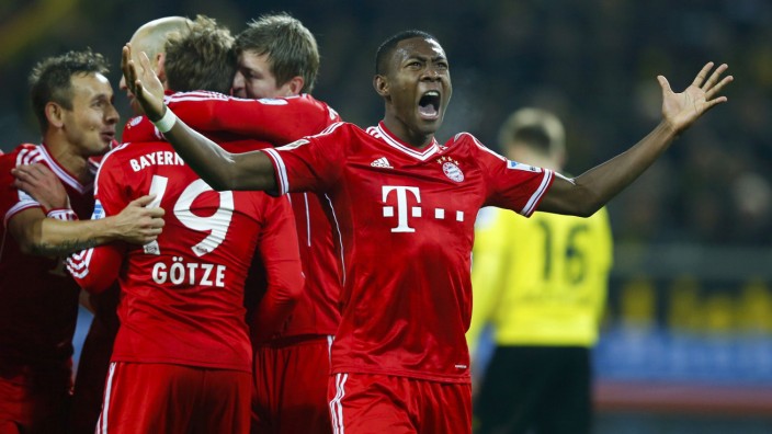 Bayern Munich's Alaba reacts after Goetze scored a goal against Borussia Dortmund during their German first division Bundesliga soccer match in Dortmund