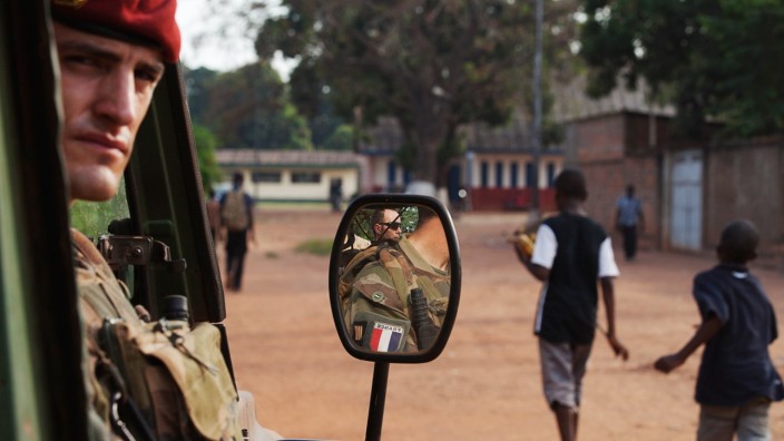French soldiers stand guard during a patrol to check on the safety of French nationals in Bangui