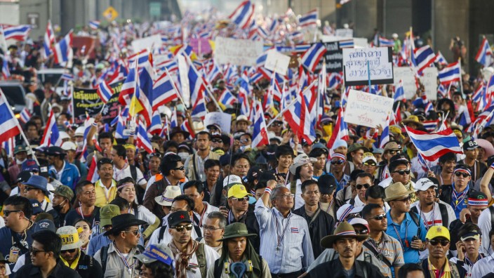 Protest leader Suthep marches with anti-government protesters during a rally in Bangkok