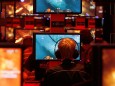 Visitors play ''World of Warcraft'' at an exhibition stand during the Gamescom 2011 fair in Cologne
