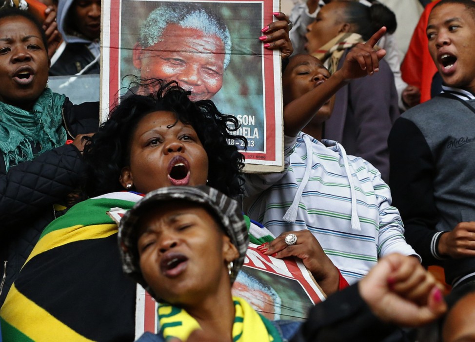 People sing and dance ahead of Mandela's national memorial service in Johannesburg