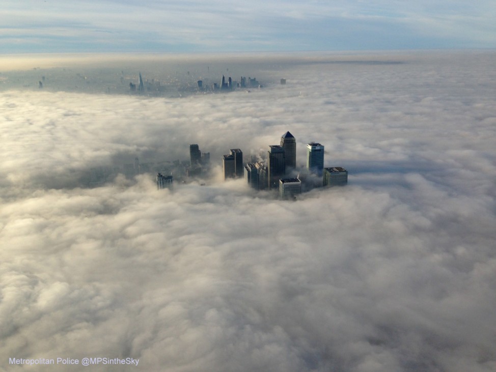 The Canary Wharf business district of east London taken from the Metropolitan Police helicopter is seen during a foggy morning in this photograph received via the Metropolitan Police in London