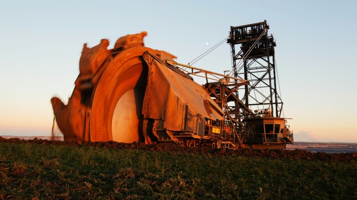 An excavator operates at the open-cast Garzweiler brown coal mine of German power supplier RWE near the village of Borschemich west of Cologne