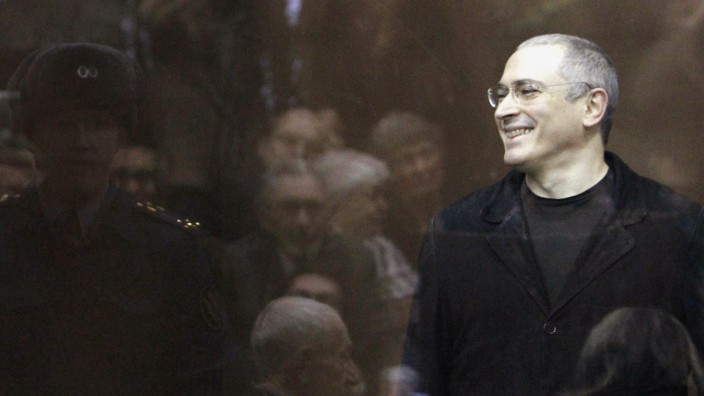 File photo of jailed Russian former oil tycoon Khodorkovsky in the defendants' cage during a court session in Moscow