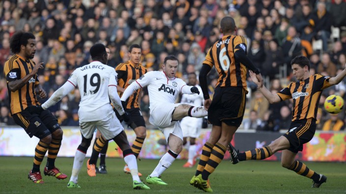 Manchester United's Rooney scores a goal against Hull City during their English Premier League soccer match in Hull