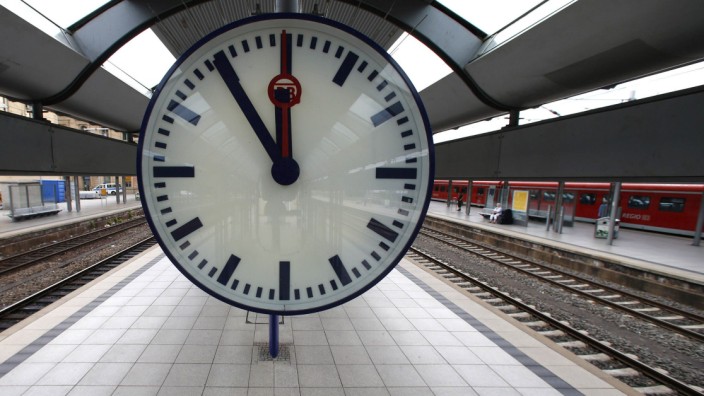 A station clock is pictured at a platform of the main train station in Mainz