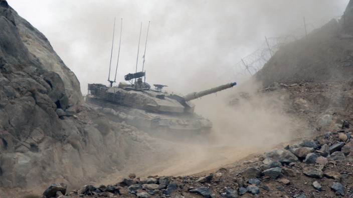 Canadian Leopard 2 tank climbs up to take a position at the top of hill in Camp Masoom Ghar in Panjwa'i district