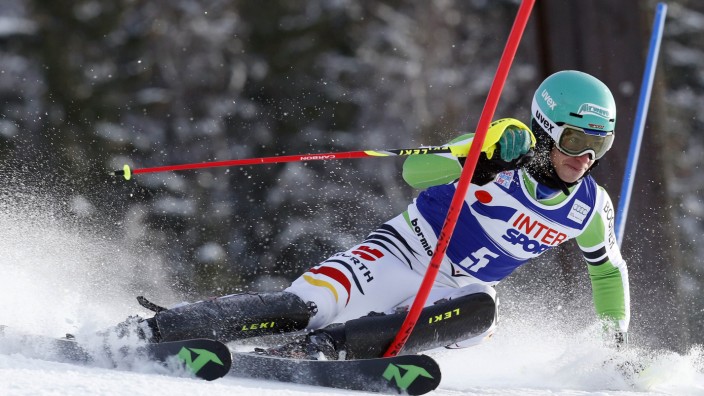 Neureuther of Germany  passes a pole during the first run of the World Cup Alpine skiing men's slalom race in Bormio