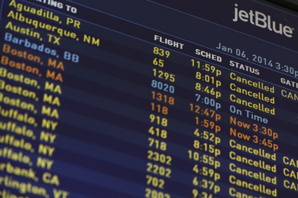 A JetBlue Airways electronic departure board is pictured inside their terminal at John F. Kennedy International Airport in New York