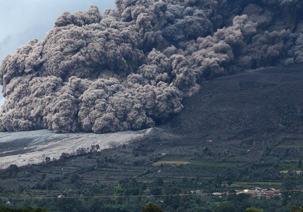 Mount Sinabung volcano spews ash during an eruption, as seen from Berastepu village in Karo district, Indonesia's North Sumatra province