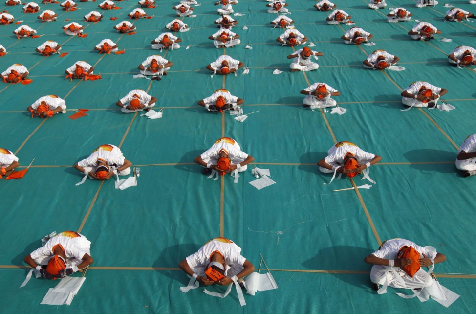 School children perform yoga before the inauguration of the international kite festival in Ahmedabad