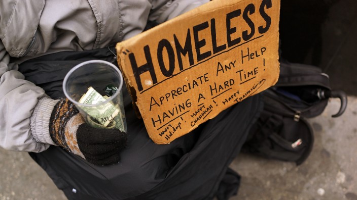 Panhandlers' Placards Show Signs Of Continued Economic Hardship