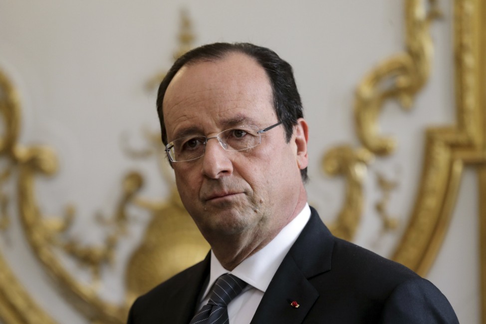 French President Francois Hollande attends a new year ceremony with members of the government at the Elysee Palace in Paris