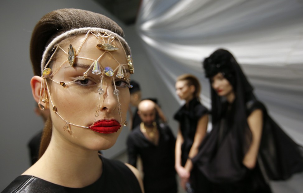 A Model poses before she present a creation by Augustin Teboul during the Berlin Fashion Week Autumn/Winter 2014 in Berlin