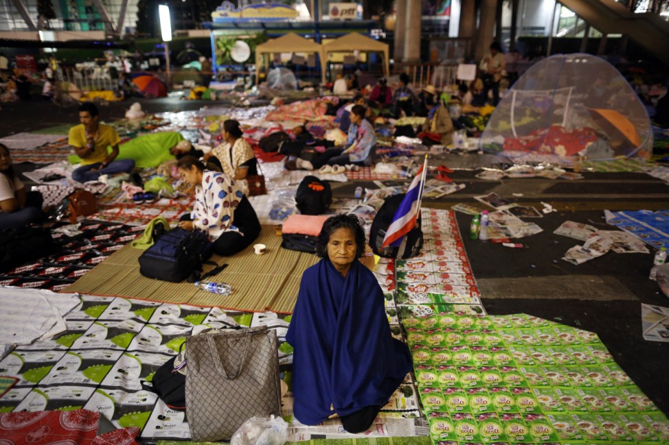 Anti-government protesters wake up in their encampment built between shopping malls in Bangkok