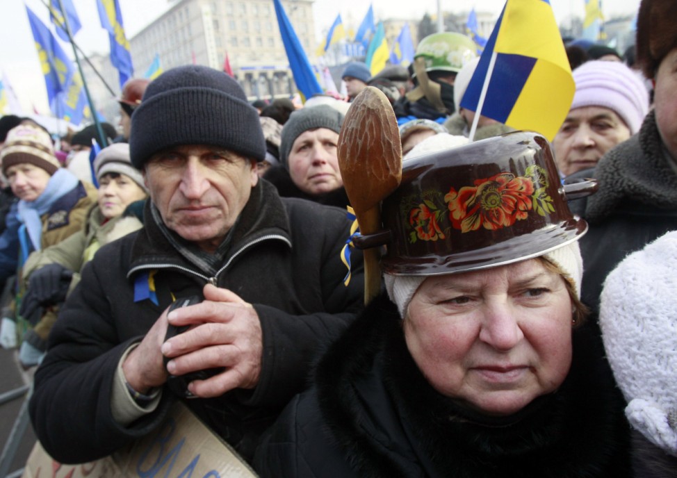 Pro-European protestors look on during a rally on Independence Square in Kiev