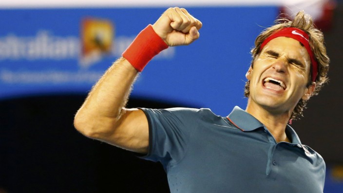 Roger Federer of Switzerland celebrates defeating Andy Murray of Britain in their men's singles quarter-final tennis match at the Australian Open 2014 tennis tournament in Melbourne