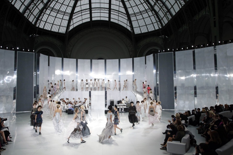 Models present creations by German designer Karl Lagerfeld for French fashion house Chanel as part of his Haute Couture Spring/Summer 2014 fashion show in Paris