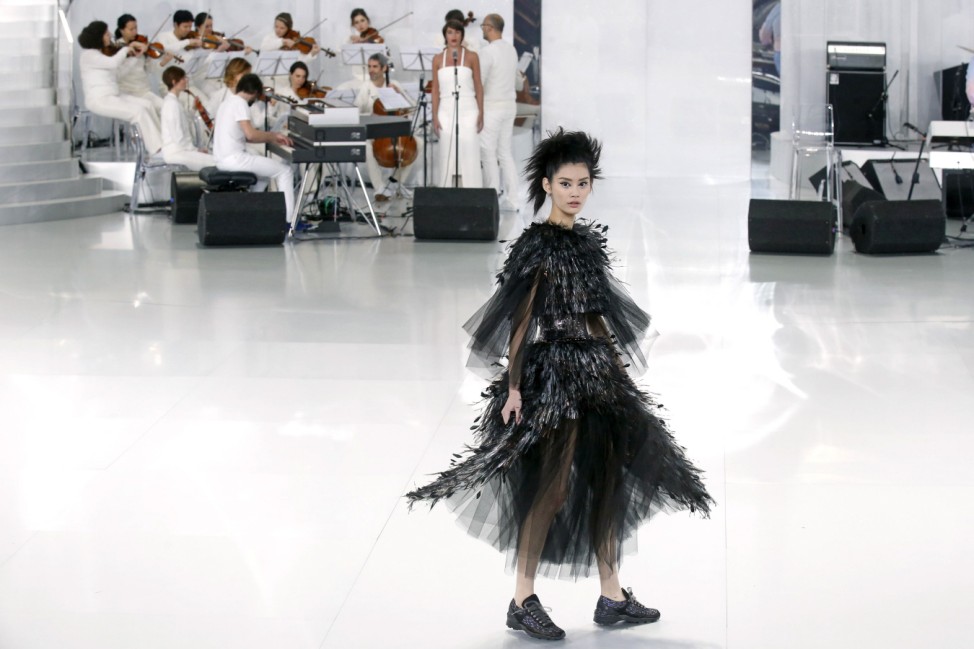 A model presents a creation by German designer Karl Lagerfeld for French fashion house Chanel as part of his Haute Couture Spring/Summer 2014 fashion show in Paris