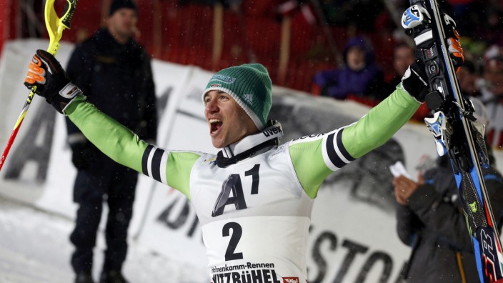 Neureuther of Germany celebrates his victory in the men's slalom race during the FIS Alpine Skiing World Cup in Kitzbuehel