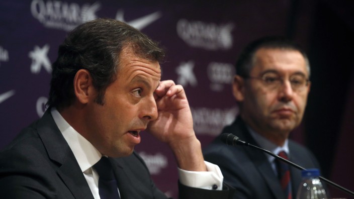 Barcelona president Sandro Rosell attends a news conference where he announced his resignation, next to vice-president Josep Maria Bartomeu, at Camp Nou stadium in Barcelona